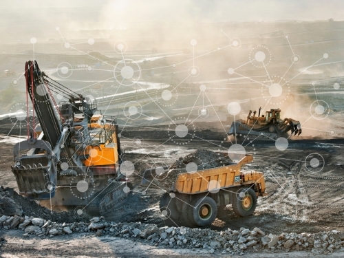 Mining site with heavy machinery and digital network overlay, highlighting industrial wireless networks and connectivity solutions 5G, LTE, MESH, and WIFI