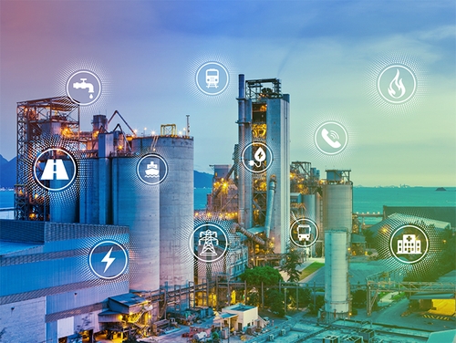 Industrial site with connectivity icons representing wireless network design and telecommunications infrastructure.